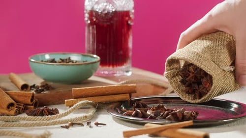 Aromatic Spices on Table with Red Liquid