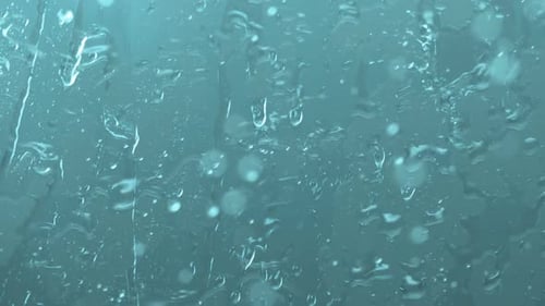 Water drops going down on window, Slow Motion