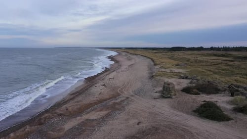 Aerial Over an Empty Beach on an Overcaste Day