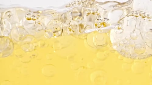 Golden Liquid with Shimmering Bubbles and Texture