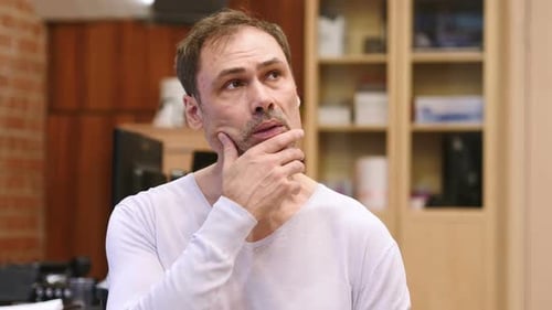 Portrait of Thinking Pensive Middle Age Man