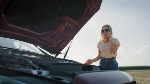 Video of woman calling for assistance on the road. Shot with RED helium camera in 8K