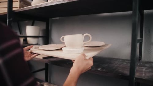 Handmade Ceramic Pottery Platet and Pots in a Potter's Workshop
