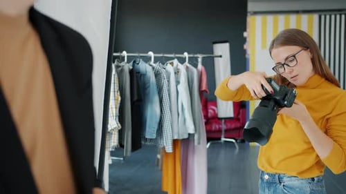 Woman Taking Pictures in Fashion Studio Photo Shoot