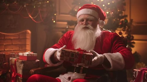 Santa Claus Holding Present in Cozy Home