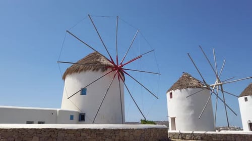 Mykonos Best Attraction Traditional Windmill Blue Sky 4k 60 fps Pan Right