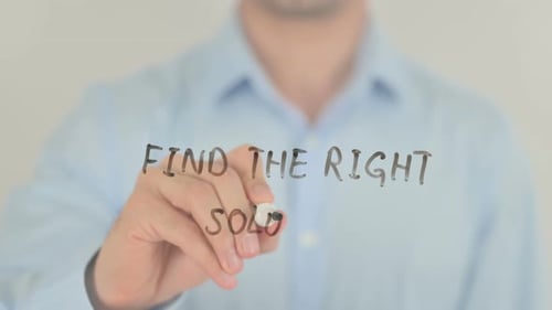 Man Writes 'Find the Right Solution' on Glass