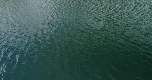 Young Couple In A Boat On The Background Of A Lake