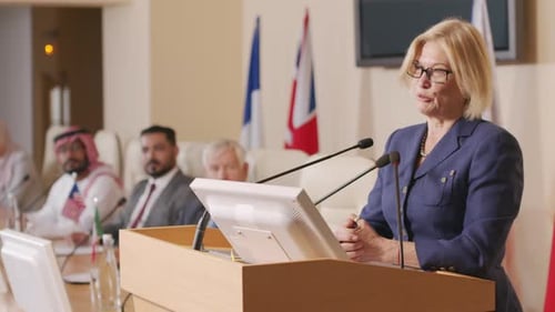 Woman Gives Speech at International Business Conference