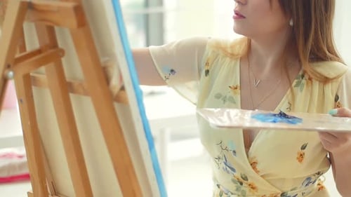 Female Artist Working at Her Workshop, Creating Beautiful Picture, Painting with Colorful Oils