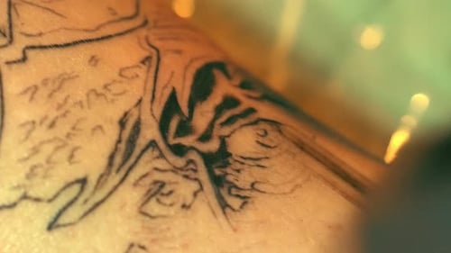 Tattoo Artist Inking Arm Close Up