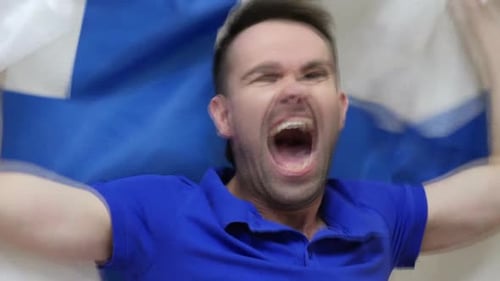 Excited Man Shouts and Holds a Flag