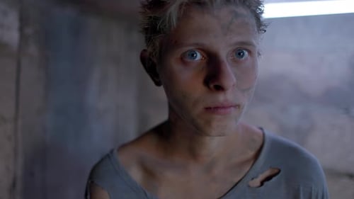 Distraught Young Adult in a Dark Location