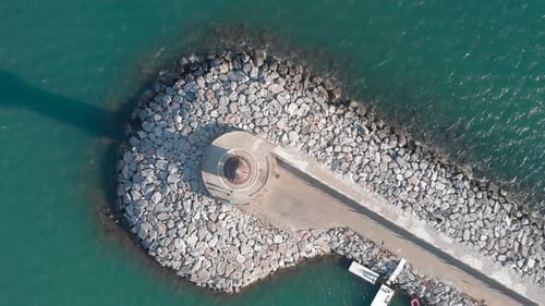 Top view of white lighthouse in blue lagoon. Alanya, Turkey.