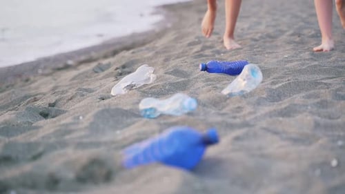 Crop People Collecting Trash On Beach