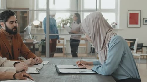 Business Meeting and Handshake in Bright Modern Office