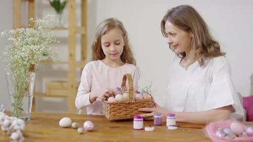 Woman and Girl with Basket of Easter Eggs Posing