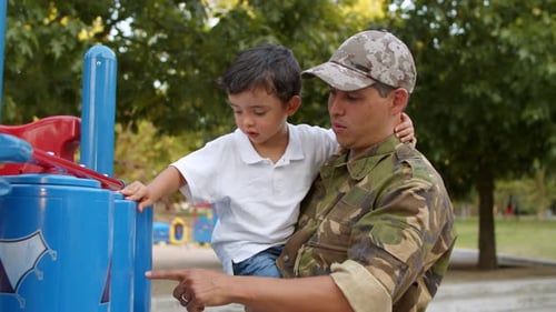 Military Dad Spending Leisure Time with Little Son in Park