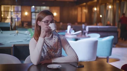 Coffee Break, Attractive Smiling Woman in Glasses Enjoys Relaxing in Cafe, Drinks Delicious Coffee