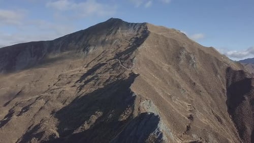 Range of peaky mountains in sunshine