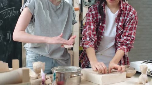Young Women Creating Crafts Together Indoors