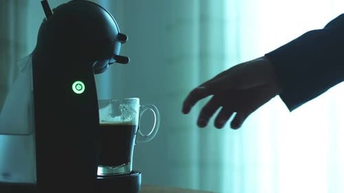 Coffee Machine Dispenses a Cup of Fresh Coffee