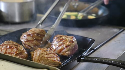 Juicy Beef Filets Sizzle on Hot Grill Pan