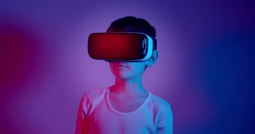 Boy Experiencing Virtual Reality With Headset, Close Up