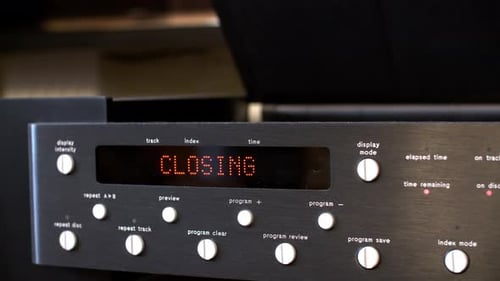 Male Hands Inserting CD Disk in Music Player. Close Up Black Digital Player Reading Disk. Video