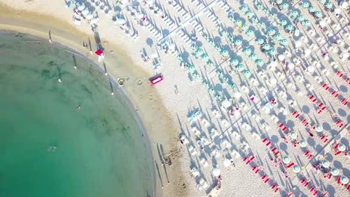 Tourist Beach And With Umbrellas