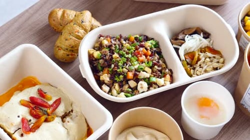 Variety of Prepared Food in Disposable Containers Overhead