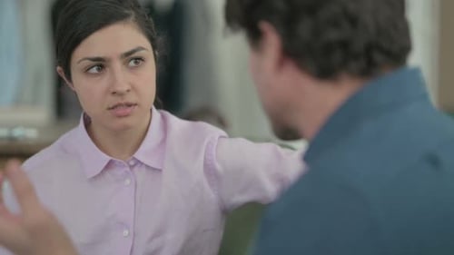 Woman Talking to Man During Serious Discussion