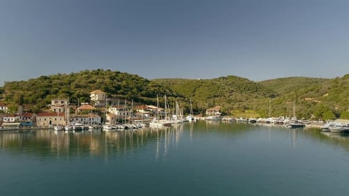 Aerial view of group of boats anchored on coast of mediterranean sea, Greece.