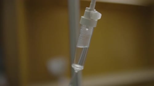 Slow motion IV drip of saline.