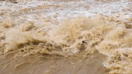 Dirty water of muddy river in flooding period during heavy rains in spring.