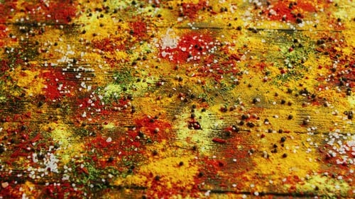 Assorted Spices Scattered Artistically on Wooden Surface