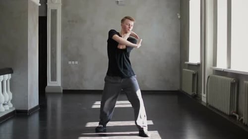 Young Dancer Hiphop Dancing in an Dark Building