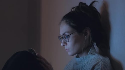 Attractive Female use smartphone at night. Close up. 4k.