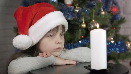 Festive Moment with Burning Candle at Christmas