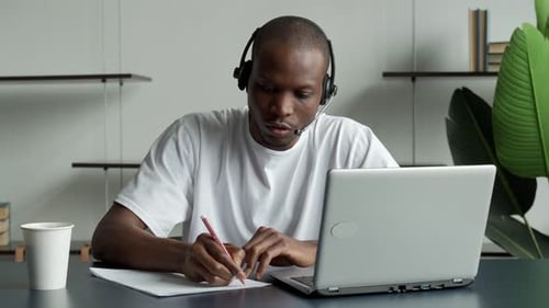 Man with Headset Working at Home Office