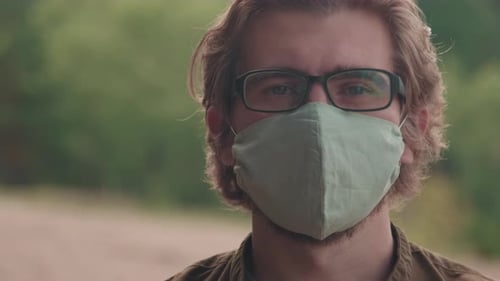Close-Up Of Man Outdoors In Cotton face Mask