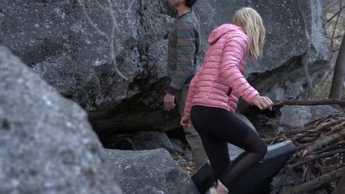 Young Couple Preparing for Boulder Climbing Adventure