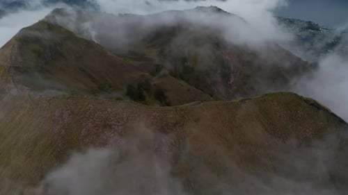 Close Up Aerial View of the Top of the Mountain Ridge on Active Volcano Mount Batur Surrounded By