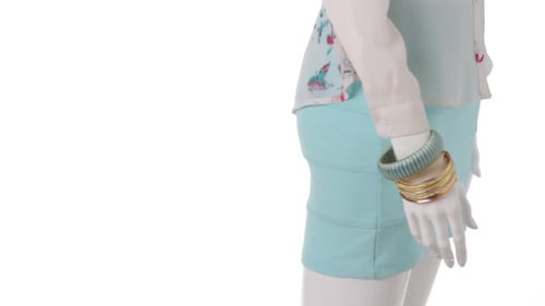 Mannequin Displaying Skirt Shirt and Bracelets