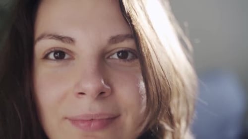 Smiling Young Woman's Face in Close Up