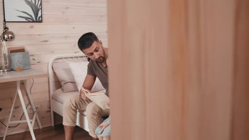 Dad Reading Story to Daughter in Cozy Bedroom