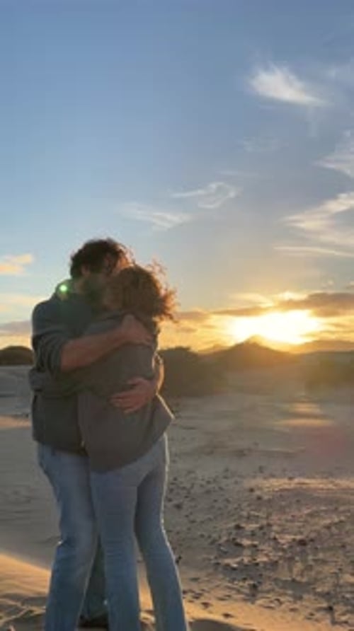 Loving Couple Embracing at Sunset on Beach