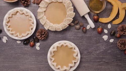 Preparing delicious pumpkin pies with autumn decoration
