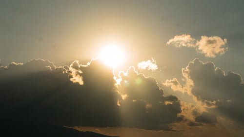 Radiant Sun Shining Through Dramatic Cloudscape