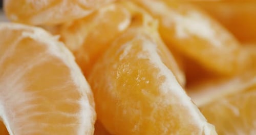 Pieces of Ripe Tangerines Slowly Rotate.